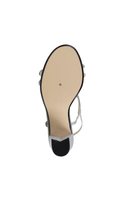 A close-up of the Sam Silver Block Heel Prom Shoes 4597 showing the smooth beige sole and elegant silver straps.