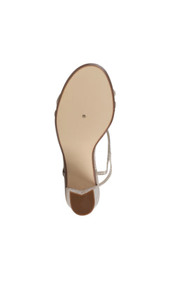 The image shows the bottom view of the Sam Champagne Black Heel Prom Shoes 4598, featuring a beige sole and a narrow, glittery strap—ideal for those seeking stylish rhinestone prom shoes or shimmering strappy heels.