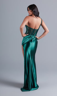 A woman models the One-Shoulder Dark Green Prom Dress by PromGirl, featuring a floor-length satin skirt with side slit and sequined bodice, against a plain gray background.