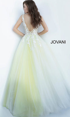 A woman wears the Jovani Tulle Prom Ball Gown with Floral Appliques, featuring a floor-length yellow gradient tulle skirt, white lace sleeveless bodice with floral details, deep V-back, and "JOVANI" on the right side.