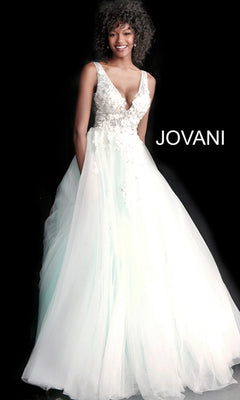 A woman wears the Jovani Tulle Prom Ball Gown with Floral Appliques, featuring a floor-length white skirt, fitted embroidered bodice, deep V neckline, and delicate floral details. "JOVANI" appears beside her on a black background.