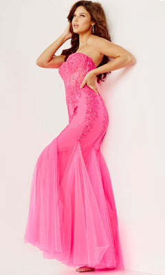 Woman wearing the Long Strapless Sweetheart Jovani Prom Dress 5908, a fitted mermaid gown with sheer tulle accents and sparkling sequins, poses against a white background, radiating classic glamour.