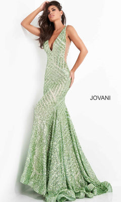 A woman poses against a white background in the Jovani Plus-Size Mermaid Prom Dress with Sequins—sleeveless, fitted, light green, with a deep V-neckline and classic mermaid silhouette. "JOVANI" is displayed on the right.