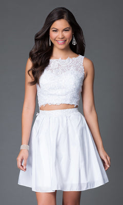 A woman in a Two-Piece Lace-Bodice Short Party Dress with a matching skirt stands against a plain gray background, smiling at the camera.