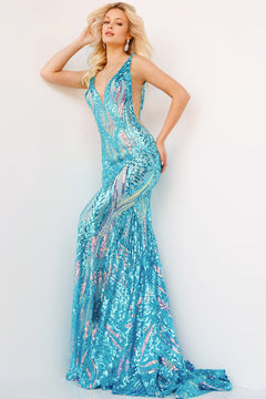 A woman poses in a floor-length, sleeveless Backless Jovani Prom Dress with iridescent jade sequins and a deep V neckline, set against a plain white background.