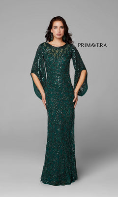 A woman poses against a plain gray background in the Long Bell Sleeve Beaded Evening Gown 9713—an emerald green, floor-length dress with beading and sheer sleeves. The word "PRIMAVERA" appears on the right.
