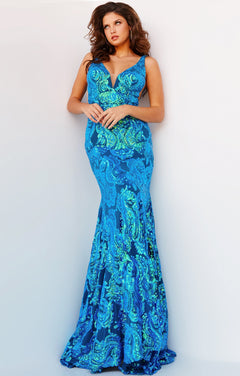 A woman poses in a floor-length, sleeveless Backless Jovani Prom Dress with a sequin pattern and a deep V-neckline, standing against a plain light background.