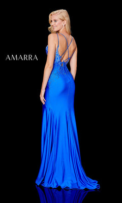 A woman poses against a black background in the Amarra Backless Long Jersey Prom Dress with Beads, a vibrant blue, floor-length mermaid gown featuring a strappy open back and embellished details. "AMARRA" appears on the left.