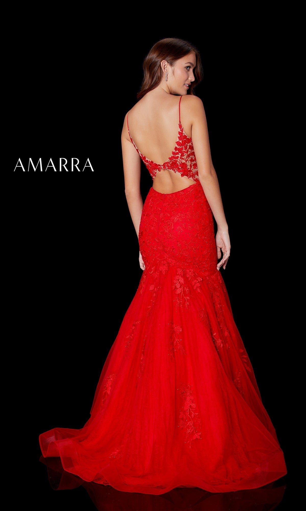 A woman faces away on a black background wearing the Amarra 87226 Long Lace Mermaid Prom Dress in striking red, featuring a backless design, tulle detailing, and lace. 