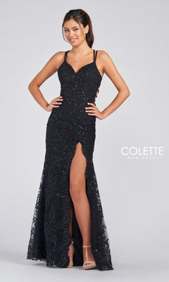 A woman wears the Colette by Daphne Prom Dress CL12280, a sleeveless black lace and sequin gown with thin straps, a thigh-high slit, and intricate detailing, standing against a plain background.