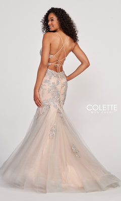 Woman in a Colette Silver Lace Long Nude Mermaid Prom Dress featuring silver lace details, nude tones, a fitted silhouette, open strappy back, and a tulle flared skirt for elegant prom style.