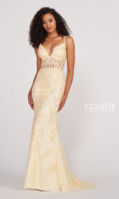 A woman poses against a plain background in the Colette Beaded-Lace Long Prom Dress with Corset, featuring light yellow beaded-lace detailing, a sheer bodice, thin straps, and a flattering mermaid silhouette.