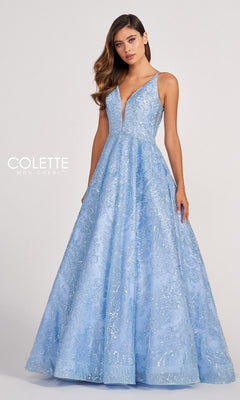 A woman wears a sleeveless Light Blue V-Neck Prom Dress with Glitter Print, standing against a plain background.