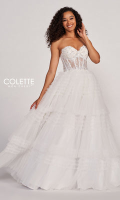 A woman models the Colette CL2017 Strapless Ruffled Prom Ball Gown with a beaded corset bodice and tulle skirt, standing against a plain background. "Colette Mon Cheri" appears on the left.