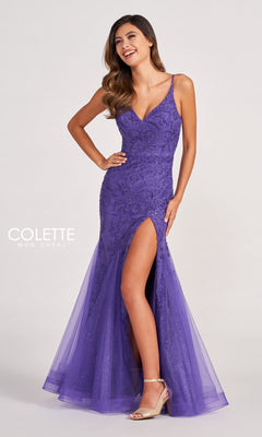 A woman poses confidently with one hand on her hip, wearing the Colette CL2024 Sequin-Lace Cut-Out Long Prom Dress, a fitted purple gown with a thigh-high slit and delicate spaghetti straps.