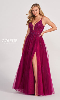 A woman poses against a plain background wearing the Beaded Lace Long A-Line Prom Dress Colette CL2025, featuring a sleeveless deep magenta design with a plunging neckline, beaded lace details, and a thigh-high slit.