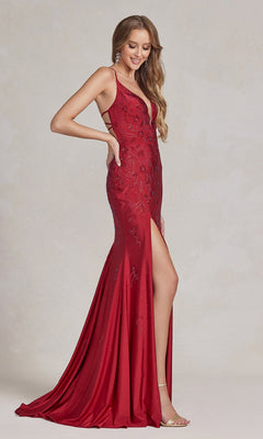 A woman wears a sleeveless, floor-length Backless Prom Dress with Floral Beaded Pattern, featuring a red v-neck and thigh-high slit, standing against a neutral background.