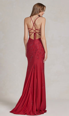 A woman stands against a neutral background, wearing the Backless Prom Dress with Floral Beaded Pattern—floor-length, fitted silhouette, v-neckline, sequin floral beading, and an open strappy back.