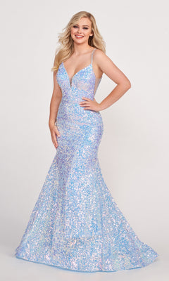 A woman in an Ellie Wilde Long Stretch-Sequin Prom Dress, a sleeveless, floor-length light blue gown with a deep V-neck and strappy back, stands smiling against a plain background.