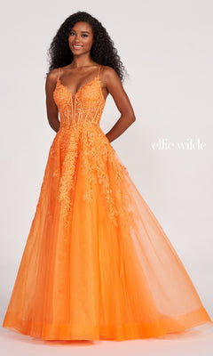 A woman in the Sheer-Corset Long Lace Prom Ball Gown EW34036, a floor-length bright orange dress with beaded floral lace details and thin straps, stands against a light background. Text reads "Ellie Wilde.
