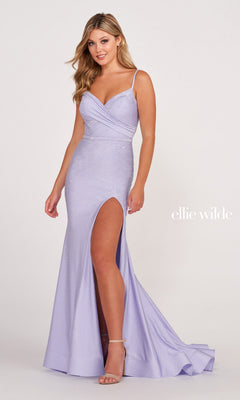 A woman models the Ellie Wilde Beaded Long Cut-Out Prom Dress in light purple, featuring thin straps, beaded embellishments, a thigh-high slit, and subtle details, posed against a light background.