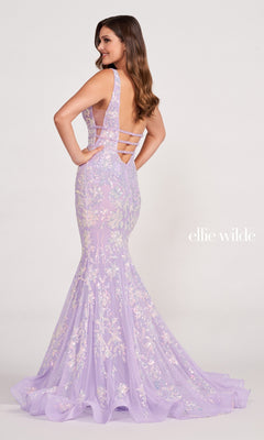 Woman wearing a Banded-Waist Long Sequin Mermaid Prom Dress featuring a lavender hue, floor-length design, sleeveless style, floral embellishments, and open strappy back, posed against a plain background.