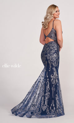 A woman stands facing away, wearing the Sequin and Glitter Mermaid Prom Dress by Ellie Wilde in navy blue with silver sequins and an open back.