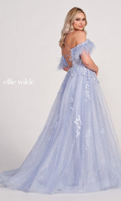 A woman poses with her back turned in the Glitter Ball Gown With Off The Shoulder Feather Sleeves, showcasing its elegant lace-up corset back and sparkling lace details.