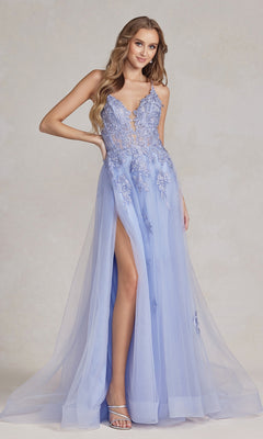 A woman poses gracefully against a neutral background in the Open-Back Long Prom Ball Gown with Beads, featuring light blue beaded lace appliqués, spaghetti straps, a sheer overlay, and a thigh-high slit.