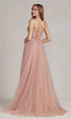 A woman models the Corset-Bodice Long Pastel Prom Dress, featuring a floor-length blush tulle skirt and lace-up back, as she stands looking over her shoulder.