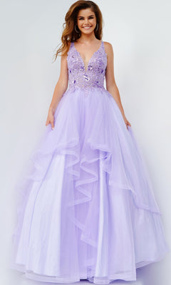 A woman in a sleeveless lavender Jovani Prom Ball Gown with a layered tulle skirt and floral-embellished bodice stands against a plain background.