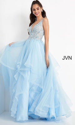 A woman stands against a white background wearing the Jovani Prom Ball Gown with a layered tulle skirt and an embellished sleeveless bodice in light blue.