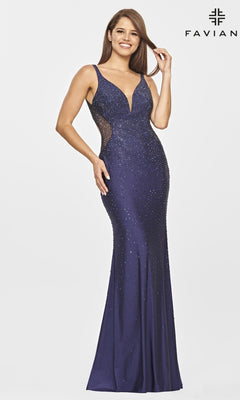 A woman stands against a white background wearing the Open-Back Long Jeweled Prom Dress by Faviana, featuring a sleeveless fitted silhouette, deep V-neckline, and sparkling jeweled embellishments.