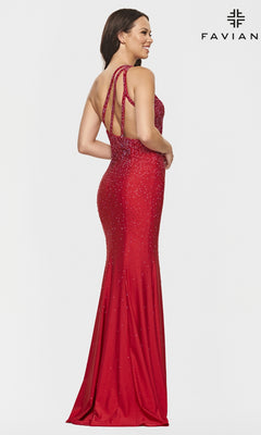 Woman wearing the Faviana Beaded One-Shoulder Long Pink Prom Dress, featuring sparkling embellishments and a fitted floor-length silhouette, stands against a plain white background.