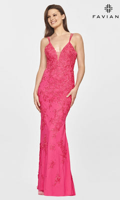 A woman models the Faviana S10813 Long Lace Hot Pink Prom Dress, featuring thin straps, lace detailing, and a deep neckline, against a plain white background.