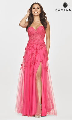 A woman smiles in the Faviana Strapless Sweetheart Long Lace Prom Dress, featuring hot pink lace embroidery, a thigh-high slit, and an elegant flowing tulle skirt. "FAVIAN" appears in the corner.