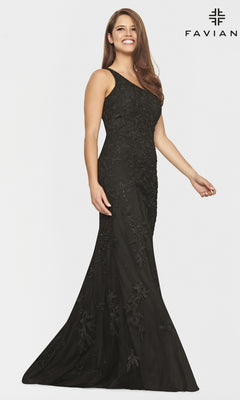 A woman stands and smiles against a plain white background, wearing a fitted One-Shoulder Faviana Long Lace Formal Dress with floral embroidery.