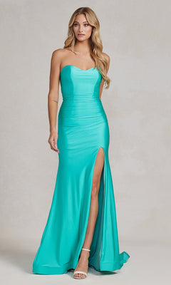 A woman in the Tight Long Sweetheart Strapless Formal Dress T1139, turquoise with a thigh-high slit and pale heels, stands against a neutral background.