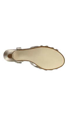 Bottom view of the Amara Champagne Low Heel Prom Shoes by Touch Ups 4484, showing the entire light-colored sole and heel with metallic upper straps.