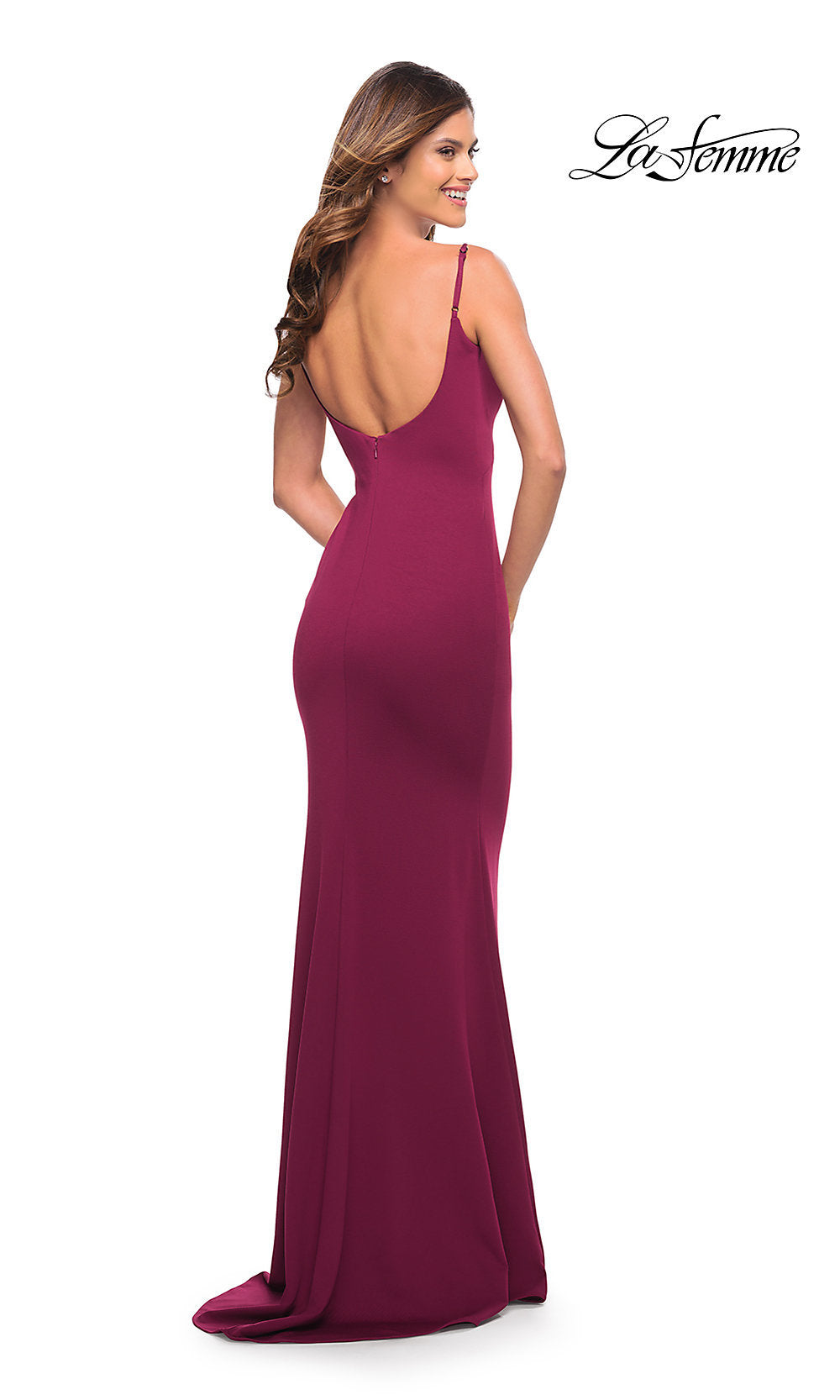 A woman with long hair stands facing away, wearing the Long Sleek and Simple Prom Dress by La Femme—a fitted, floor-length, sleeveless magenta gown with an open back. The 