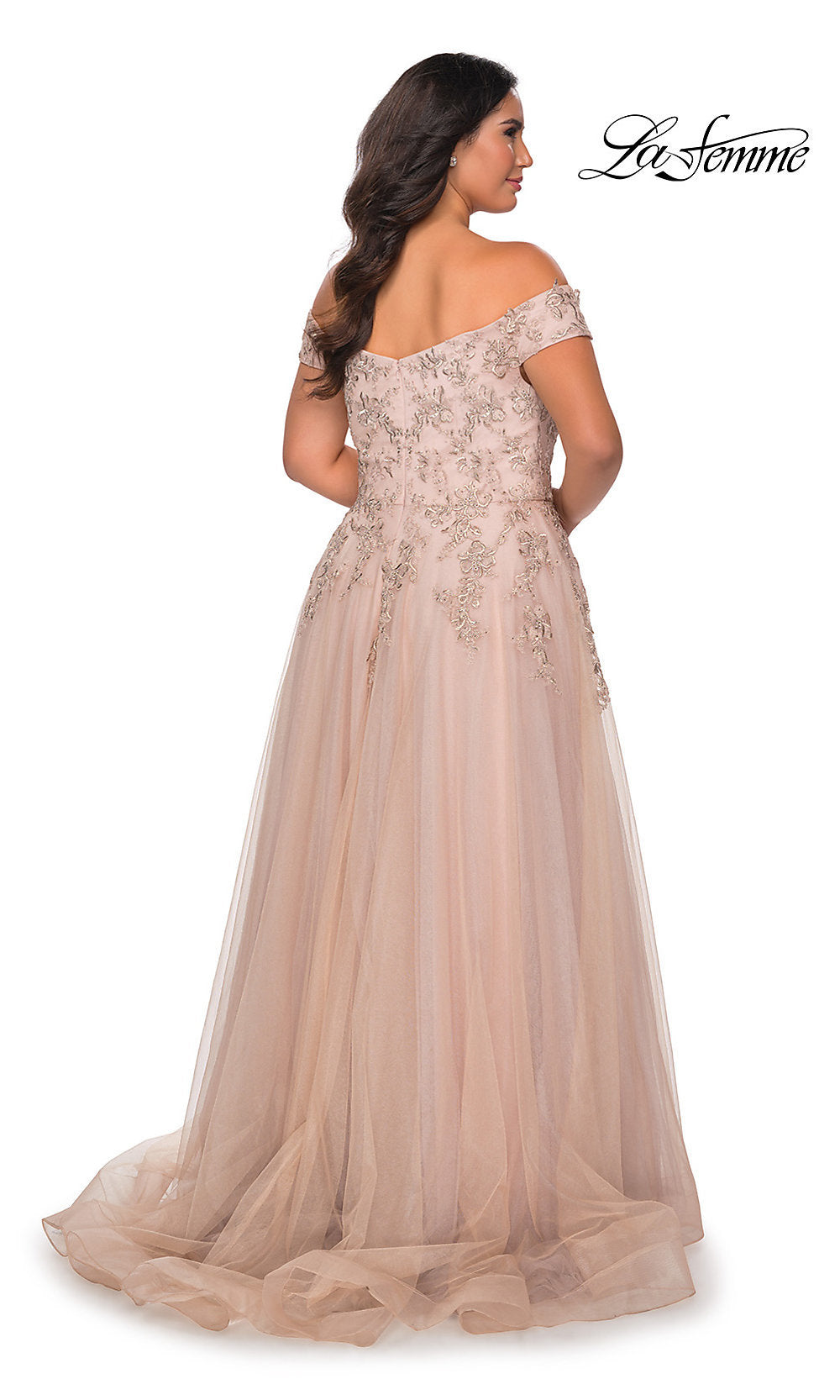 A woman is seen from the back in an off-the-shoulder, floor-length blush La Femme Plus-Size Prom Ball Gown featuring beaded embroidery and a tulle skirt. The La Femme logo appears in the top right corner.