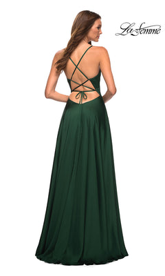 Woman in a La Femme Lace-Up Back Long Satin A-Line Prom Dress—dark green with crisscross open back and floor-length skirt—stands facing away.