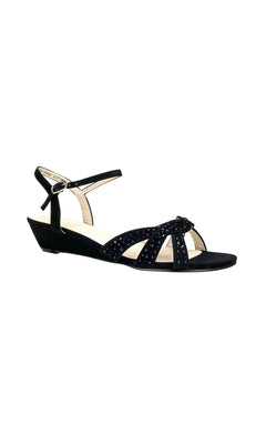 The Lena Black Open-Toe Prom Shoes (Touch Ups 4379) feature a low wedge heel, ankle strap, and decorative studs on the front straps—ideal for a stylish, comfortable prom look. Shown on a white background.
