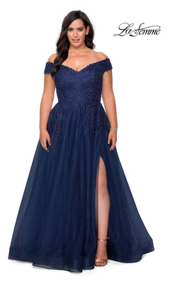 A woman models the Off-the-Shoulder Plus-Size La Femme Prom Ball Gown in navy, featuring floral lace, beaded embroidery, a tulle skirt, and thigh-high slit. The "La Femme" logo is shown in the upper right corner.