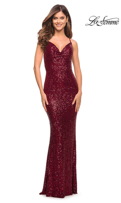 A woman smiles in the Tight Long Sequin Prom Dress: La Femme 29949—a floor-length, sleeveless, deep red gown with thin straps. The La Femme logo is shown in the top right corner.